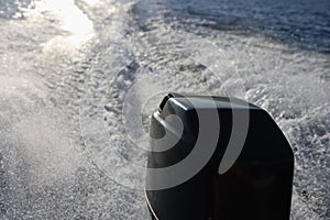 Rear view of speed boat or motor boat running high speed on sea or lake.