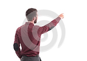 Rear view.a successful employee pointing towards the copy space.isolated on white.