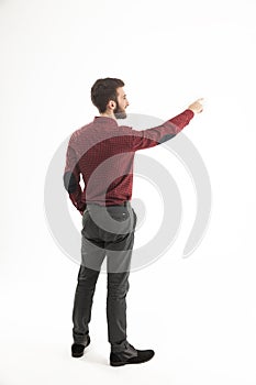 Rear view - a successful Manager of a pointing hand on the blank