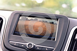 Rear view system monitor on dash camera backup at parking lots