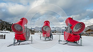 Rear view of three snow cannons in alpine ski resort