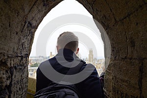 Rear View Of Tourist Looking Out Over View Of Oxford Skyline