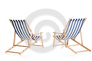 rear view of two beach chairs,