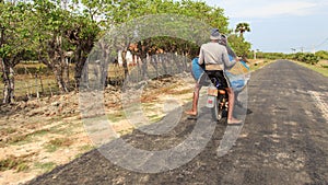 Fully laden motor bike on the way to Market - Kayts Island - Sri lanka