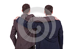 Rear view of two young business men friends