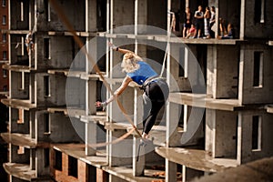 Rear view woman bending to the right on the slackline rope