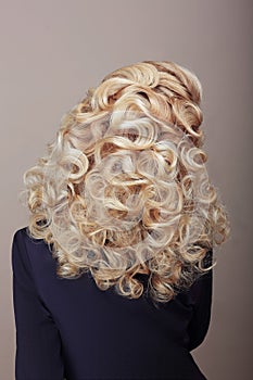 Rear View of Woman with Frizzy Ashen Hairs. Festive Braided Hairdo