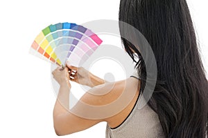 Rear view of a woman looking at paint samples