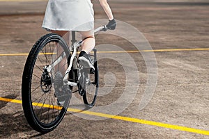 Rear view of a woman riding a bicycle