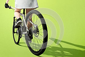 Rear view of a woman riding a bicycle