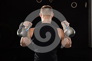 Man Doing Exercise With Kettle Bell