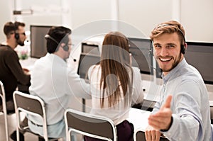 Rear view. young customer service agent sitting at his Desk