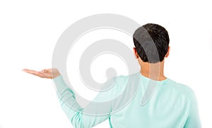Rear view of young guy posing with arm outstretched