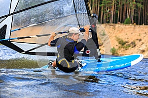 Rear view of young windsurfer close-up