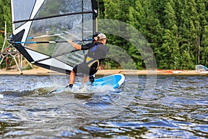 Rear view of young windsurfer