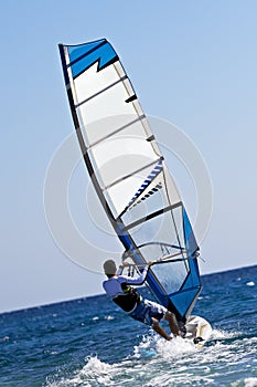 Rear view of young windsurfer