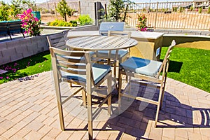 Rear Yard Setting With High Patio Table & Chairs With Cushions