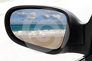 Rearview car mirror tropical caribbean beach