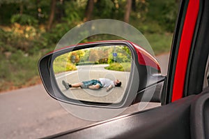 Rearview mirror with a man hit by a car