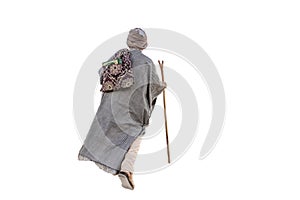 Rearview of Muslim traveler dervish walking with saddlebags and scepter on white background