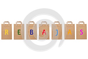 Rebajas sale word write in different paper bags