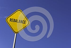 rebalance - yellow sign with blue sky background