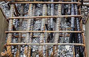 Rebar tie wire work at construction site. Steel bars reinforcing for reinforced concrete and building structures