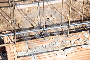 The rebars are tied together with thin wire to reinforce