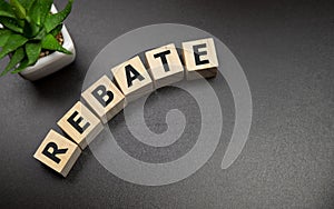 Rebate word on wooden cubes, business concept photo