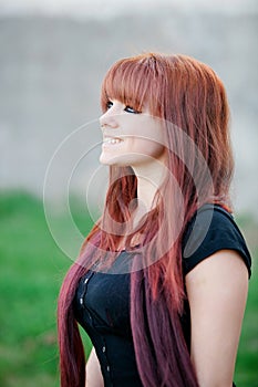 Rebellious teenager girl with red hair