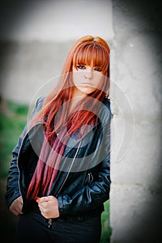 Rebellious teenager girl with red hair