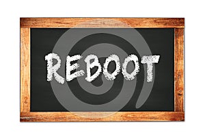 REBOOT text written on wooden frame school blackboard