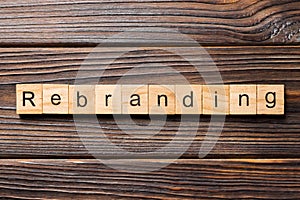 Rebranding word written on wood block. rebranding text on table, concept