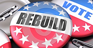 Rebuild and elections in the USA, pictured as pin-back buttons with American flag colors, words Rebuild and vote, to symbolize