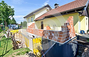 Rebuilding a family house and adding an extension.