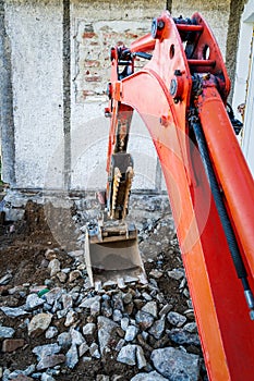 Rebuilding a house and digging dirt with excavator