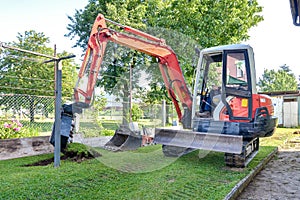 Rebuilding a house and digging dirt with excavator