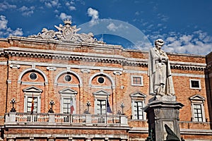 Recanati, Marche, Italy: the statue of the poet Giacomo Leopardi and the town hall