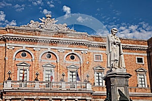 Recanati, Marche, Italy: the statue of the poet Giacomo Leopardi and the town hall photo