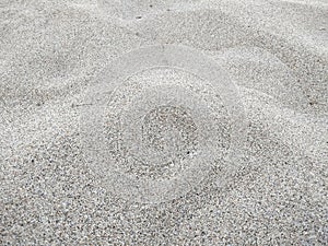 Receding tide on the beach. Sand on the beach as background