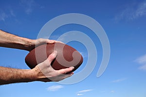 Receiver Catching an American Football Pass