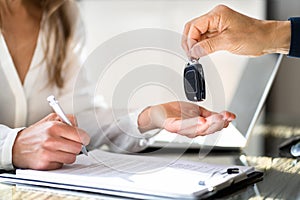 Receiving Car Key From Salesmen photo