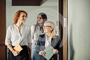 Recently recruited female employees get acquainted with office.