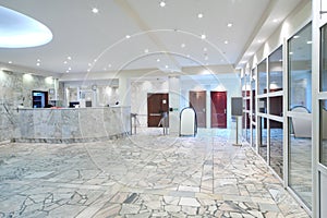 Reception area, glass entrance doors in office building