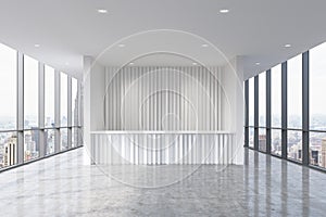 A reception area in a modern bright clean office interior. Huge panoramic windows with New York view.