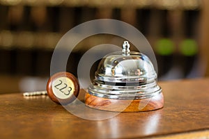 Reception - Hotel bell and key lying on the desk