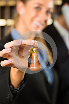 Reception in Hotel - woman with key