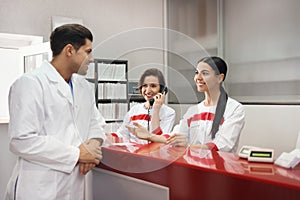 Reception of surgery clinic with working staff