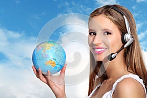 Receptionist with headphones and globe