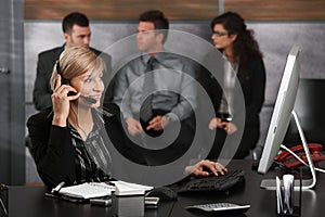 Receptionist talking on phone